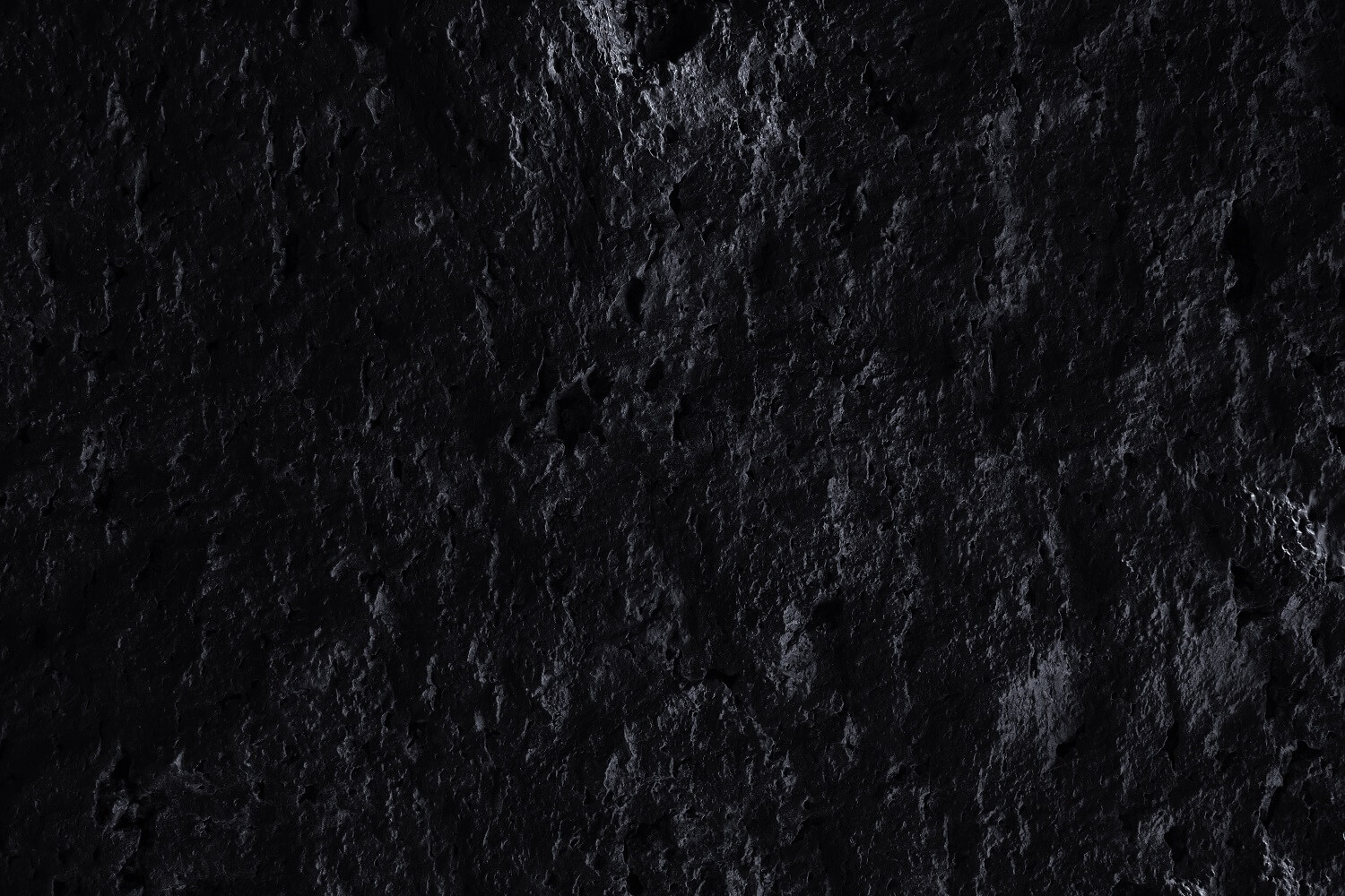 Black and rough rock surface